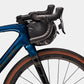 Bontrager Adventure Handlebar Bag 9L on the front of a bikes handlebars from the side with a white background