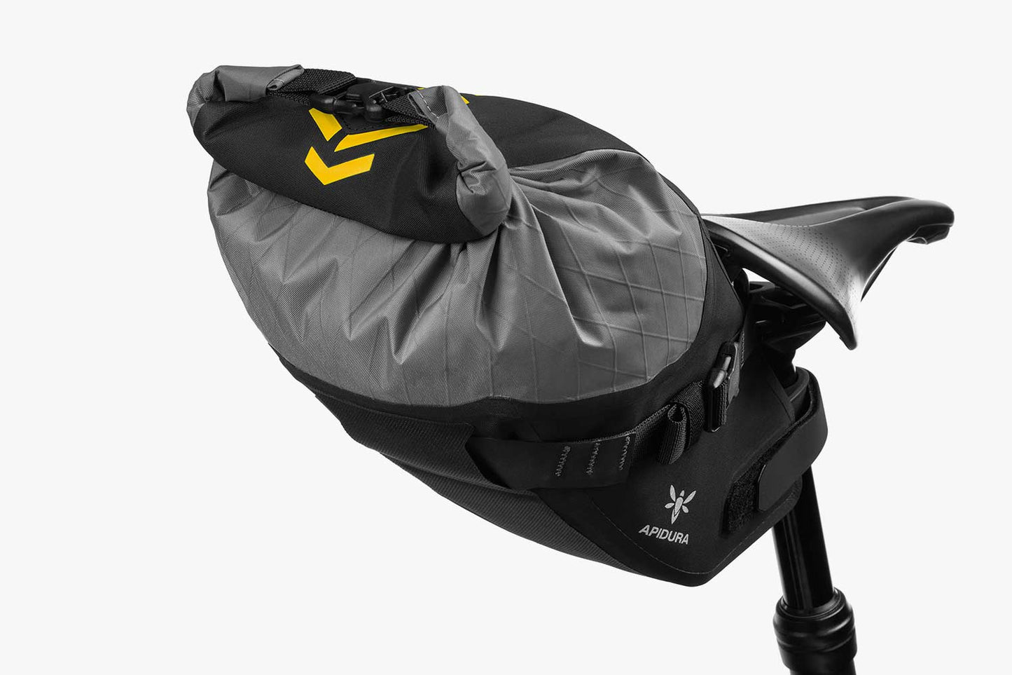 Apidura Backcountry Saddle Pack on the back of a bike from the back with a white background