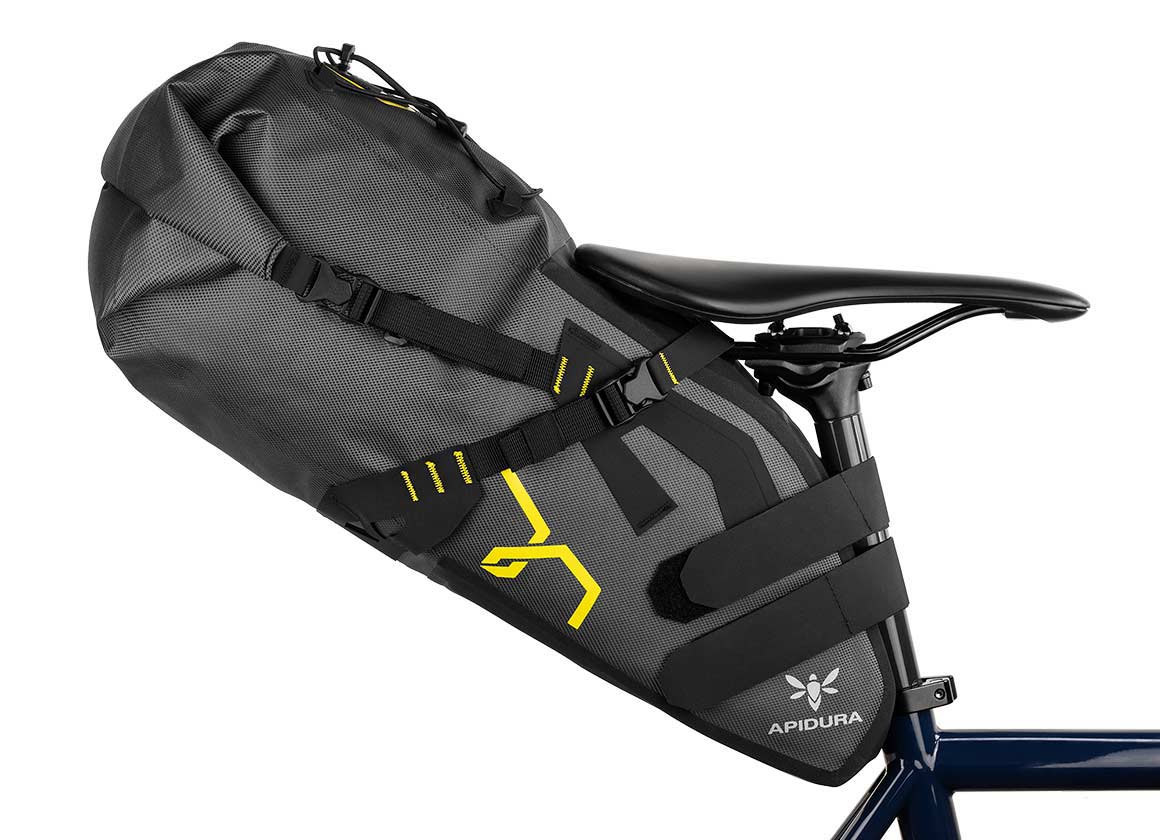 Apidura expedition saddle pack 17L attached to the back of a bike